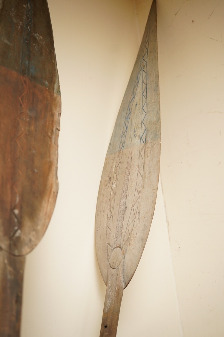 A pair of tribal paddles, 180 cm long